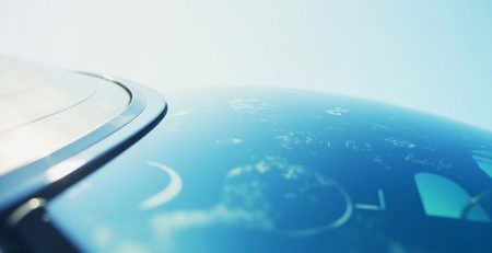 Close-up of a clean, modern car windshield reflecting a clear blue sky, hinting at smart windshield technology and auto glass innovation.