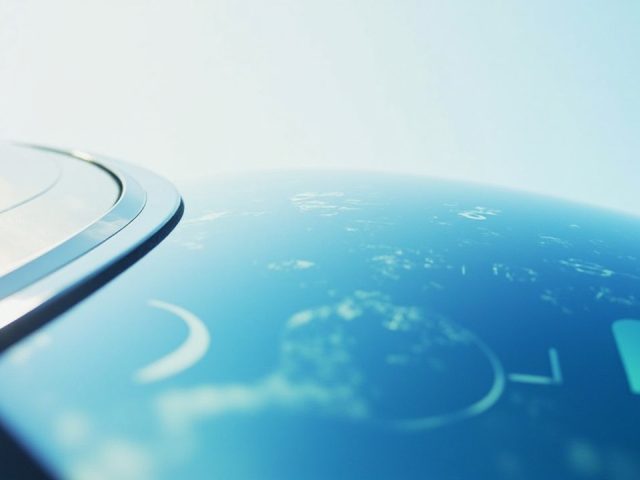 Close-up of a clean, modern car windshield reflecting a clear blue sky, hinting at smart windshield technology and auto glass innovation.